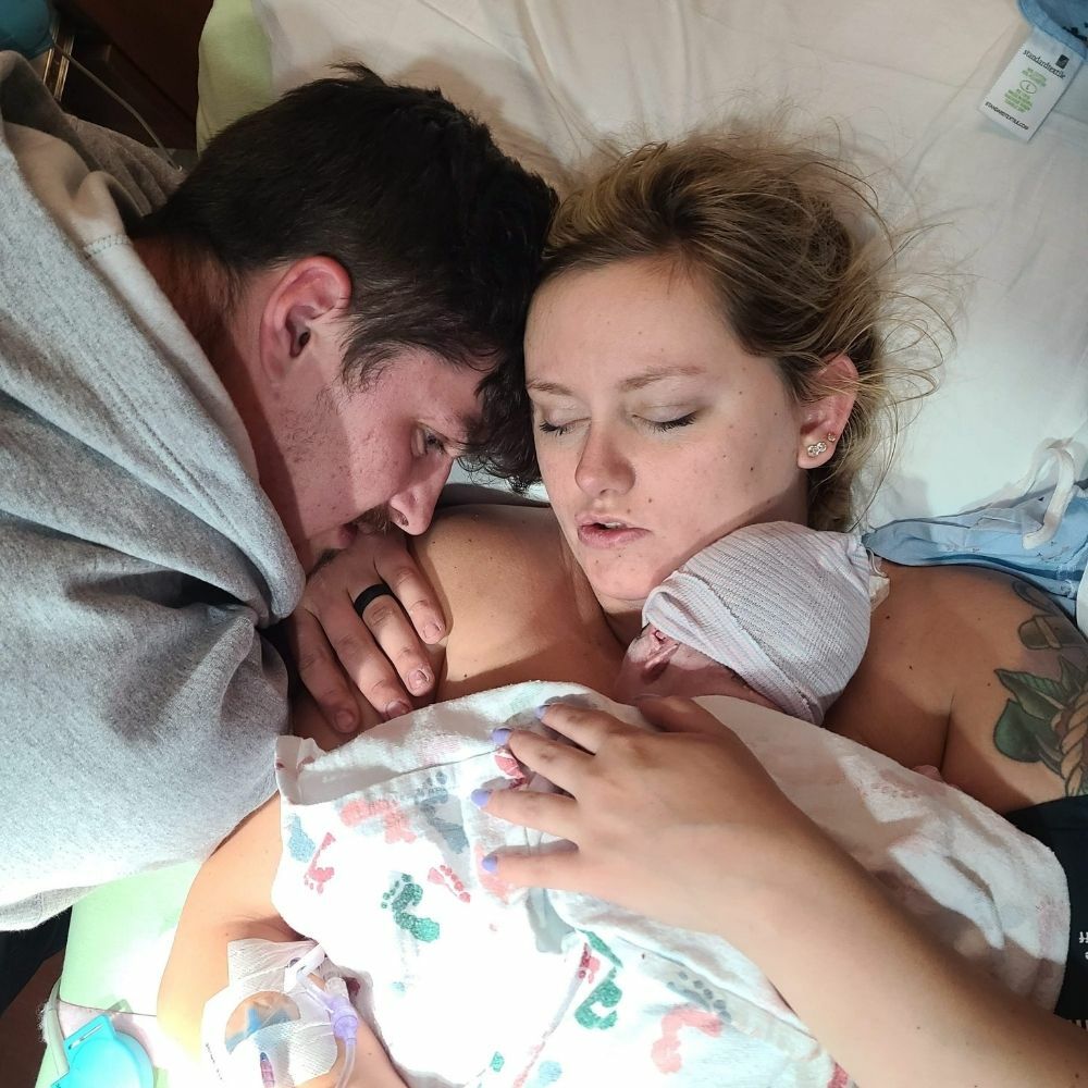 couple with newborn baby